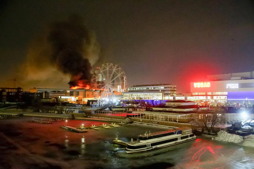 FILE - A massive blaze is seen over the Crocus City Hall concert venue on the western edge of Moscow, Russia, Friday, March 22, 2024. The attack on the venue that killed over 140 people marked a major failure of Russian security agencies. (Sergei Vedyashkin/Moscow News Agency via AP, File)