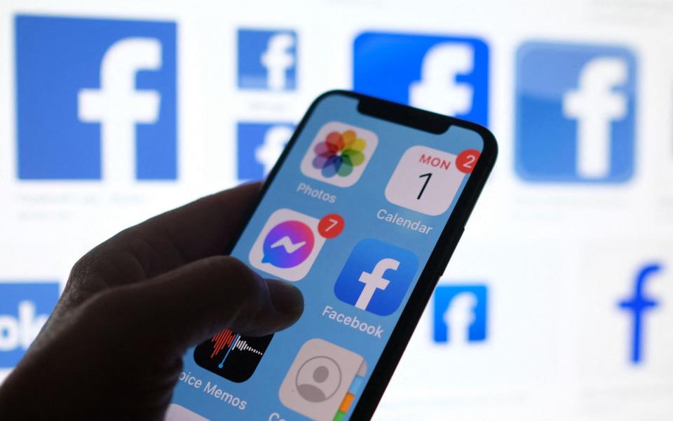 This file illustration photo shows a Facebook App logo displayed on a smartphone in Los Angeles, March 1, 2021 - Chris Delmas/AFP