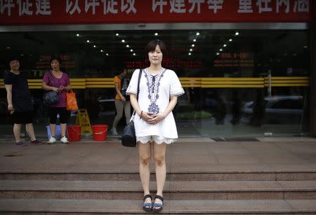 Chen Xuejun, who was born in 1987, poses for a photograph in Shanghai August 30, 2014. REUTERS/Carlos Barria/Files