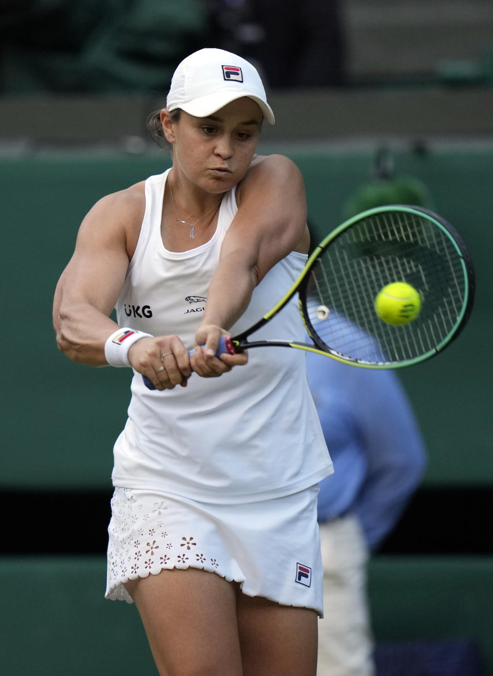 Australia's Ashleigh Barty plays a return to Czech Republic's Katerina Siniakova during the women's singles third round match on day six of the Wimbledon Tennis Championships in London, Saturday July 3, 2021. (AP Photo/Alastair Grant)