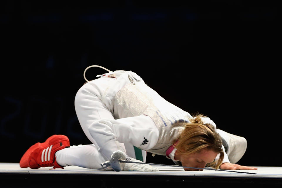 LONDON, ENGLAND - AUGUST 02: Valentina Vezzali of Italy kisses the mat as she celebrates winning gold during her contest with Larisa Korobeynikova of Russia in the Women's Foil Team Fencing gold medal match against Russia on Day 6 of the London 2012 Olympic Games at ExCeL on August 2, 2012 in London, England. (Photo by Hannah Johnston/Getty Images)