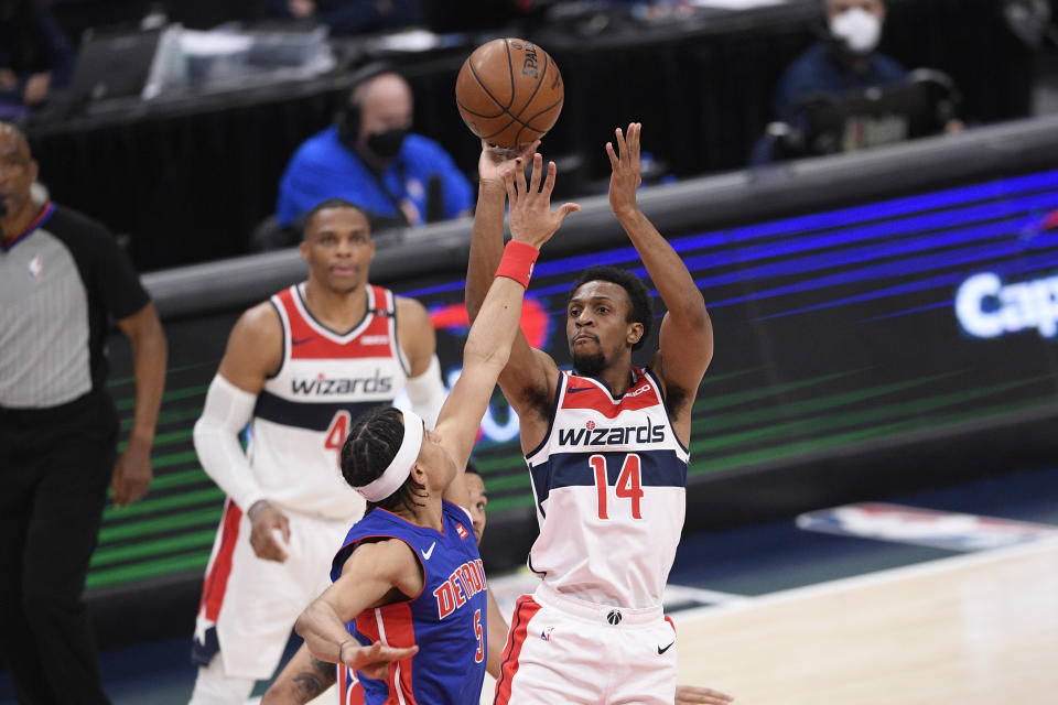 Washington Wizards guard Ish Smith (14) shoots against Detroit Pistons guard Frank Jackson (5) during the first half of an NBA basketball game, Saturday, April 17, 2021, in Washington. (AP Photo/Nick Wass)