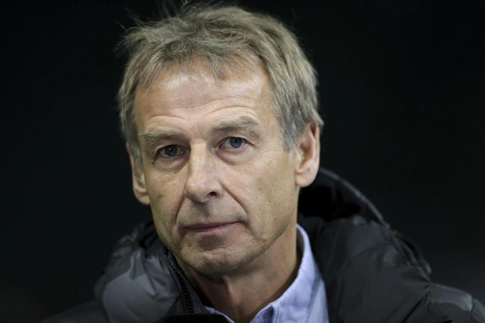 In this Saturday, Dec. 21, 2019 photo Hertha's head coach Juergen Klinsmann listens to a reporter's question during an interview prior to the German Bundesliga soccer match between Hertha BSC Berlin and Borussia Moenchengladbach in Berlin, Germany. (AP Photo/Michael Sohn)