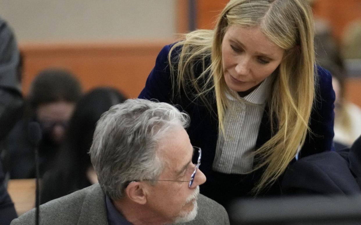 Gwyneth Paltrow speaks with retired optometrist Terry Sanderson after the verdict was read in his $300,000 suit in Utah against her over a skiing accident - Getty Images North America