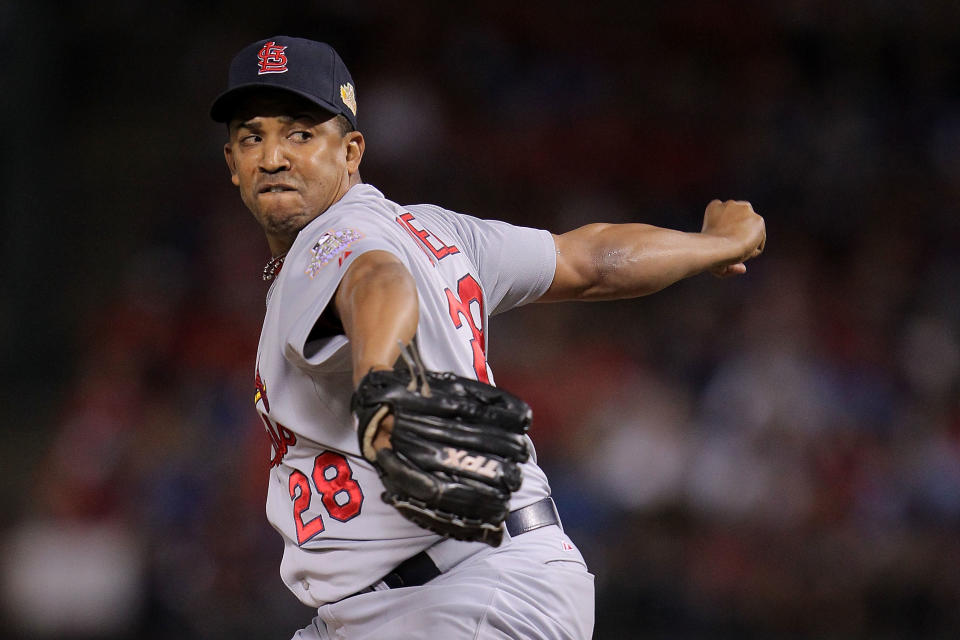 ARLINGTON, TX - OCTOBER 22: Octavio Dotel #28 of the St. Louis Cardinals pitches in the seventh inning during Game Three of the MLB World Series against the Texas Rangers at Rangers Ballpark in Arlington on October 22, 2011 in Arlington, Texas. (Photo by Doug Pensinger/Getty Images)