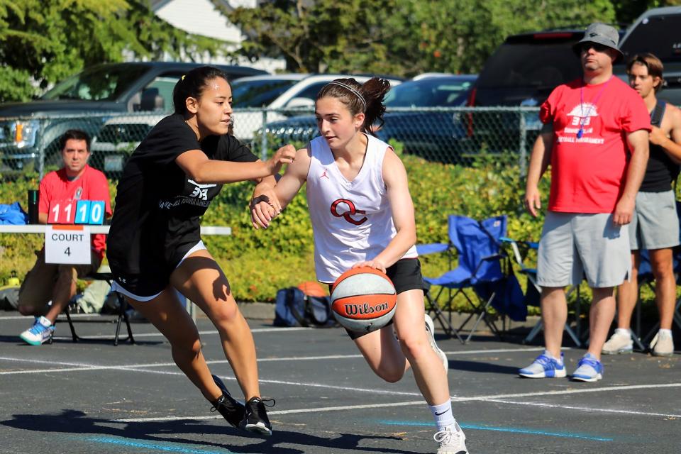 Recent high school graduates Hailey Carroll (right) of Central Kitsap and Char Katz of Klahowya compete in a game Saturday at the Sports Beyond 3-on-3 Summer Slam tournament in Silverdale.