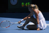 Anett Kontaveit of Estonia seacts after a fall against Clara Tauson of Denmark during their second round match at the Australian Open tennis championships in Melbourne, Australia, Thursday, Jan. 20, 2022. (AP Photo/Andy Brownbill)