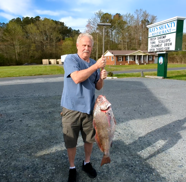 Ray Twiford holds up a black drum (Photo: George Noleff)