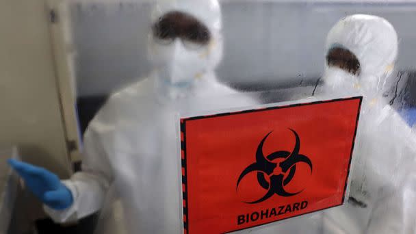 PHOTO: Health workers wearing personal protective equipment are seen inside the molecular laboratory facility set up by the Tamil Nadu Health Department to test the Monkeypox virus in Chennai, India, July 28, 2022. (Sri Loganathan/ZumaPress, FILE)