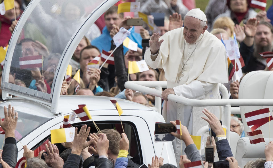 Pope Francis greets people as he arrives for a Holy Mass at the Shrine of the Mother of God, in Aglona, Latvia, Monday, Sept. 24, 2018. Francis is visiting Lithuania, Latvia and Estonia to mark their 100th anniversaries of independence and to encourage the faith in the Baltics, which saw five decades of Soviet-imposed religious repression and state-sponsored atheism. (AP Photo/Mindaugas Kulbis)