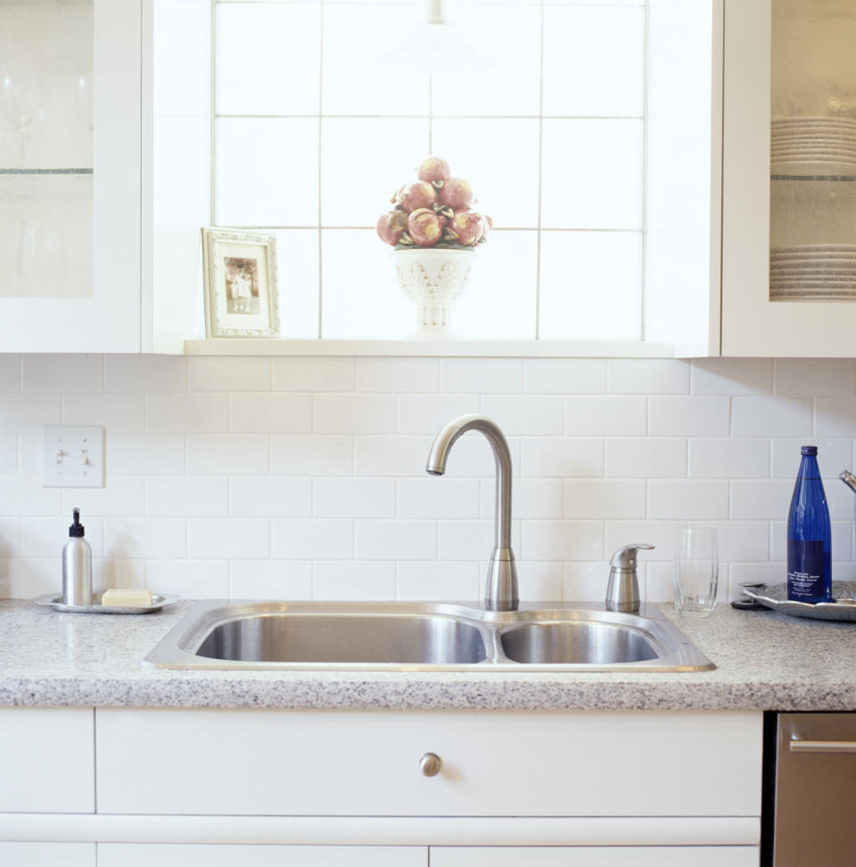 Whether they're in your bathroom or kitchen, those little cabinets under your faucet can be a cleaning-solution hideaway: products go in, multiply with every "As Seen on TV" commercial (or half-off sale) you see/encounter and before you know it, you open the doors to an avalanche of all-purpose, lemon-scented, stain-fighting, odor-absorbing potions. One easy way to avoid being buried alive -- and to maximize your storage space -- is to <a href="http://www.jenthousandwords.com/2010/09/under-my-sink.html" target="_blank"> install a tension rod inside the cabinet</a>. Yes, the very same kind you'd use to hang a curtain. You can let spray bottles hang from their triggers along the rod, freeing up the bottom of the cabinet for your scrub brushes, garbage bags and other supplies. Before buying the rod, measure your cabinet and opt for a slightly longer size, so the rod won't collapse under the weight of the bottles, recommends blogger Jennifer Morris of <a href="http://www.jenthousandwords.com/" target="_blank">Jen Thousand Words</a>.