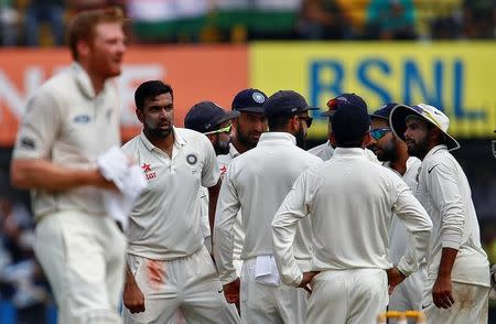 Cricket - India v New Zealand - Third Test cricket match - Holkar Cricket Stadium, Indore, India - 10/10/2016. India with Ravichandran Ashwin celebrates with teamamate after taking the wicket of New Zealand's Tom Latham. REUTERS/Danish Siddiqui