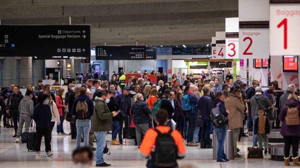 People waiting for their bags at the airport