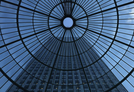 One Canada Square Tower is seen through a glassed domed roof in Canary Wharf financial district in London, Britain, December 1, 2017. REUTERS/Russell Boyce