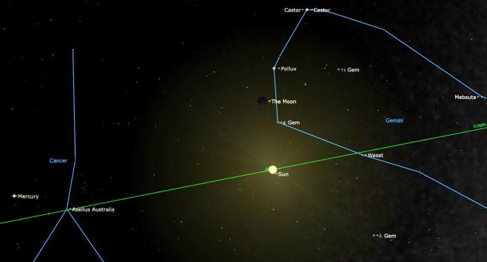  July 17, 2023 at 18:32 GMT - A New Moon hangs in a dark sky above the sun 