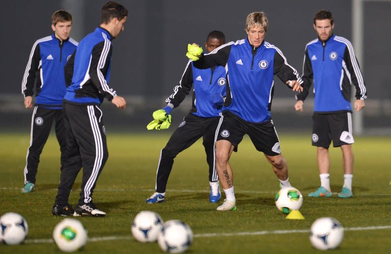 Chelsea forward Fernando Torres (2nd R) during a team training session in Tokyo on December 15, 2012. "The Liverpool-Chelsea rivalry... may have created an animosity which is understandable, but in time that will all change," he said