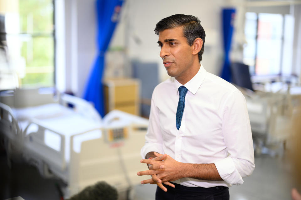 LONDON, ENGLAND - OCTOBER 28: Prime Minister Rishi Sunak speaks with members of the media as he visits Croydon University hospital on October 28, 2022 in London, England. The Prime Minister is reported to be reviewing proposals for next month’s autumn statement, in a bid to raise up to £50 billion a year through a combination of spending cuts and tax rises. (Photo by Leon Neal - WPA Pool/Getty Images)