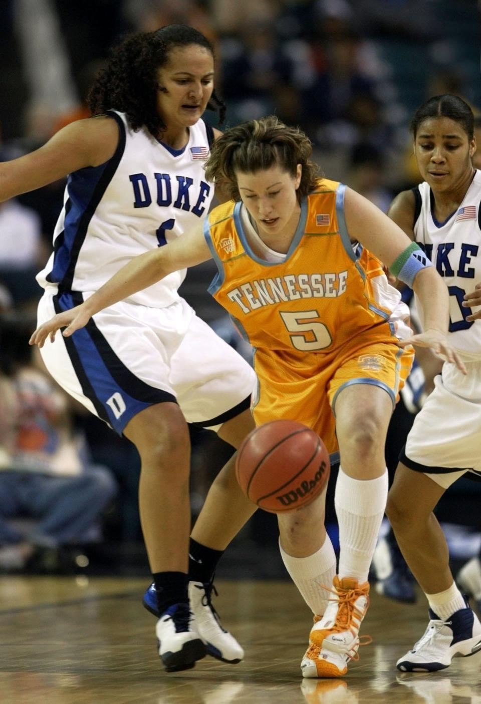 Tennessee guard Shana Zolman (5) chases down a loose ball along with Duke's Mistie Bass (1) and Lindsey Harding, right, in the first half of their semifinal round game at the NCAA Women's Final Four on Sunday, April 6, 2003 in Atlanta.