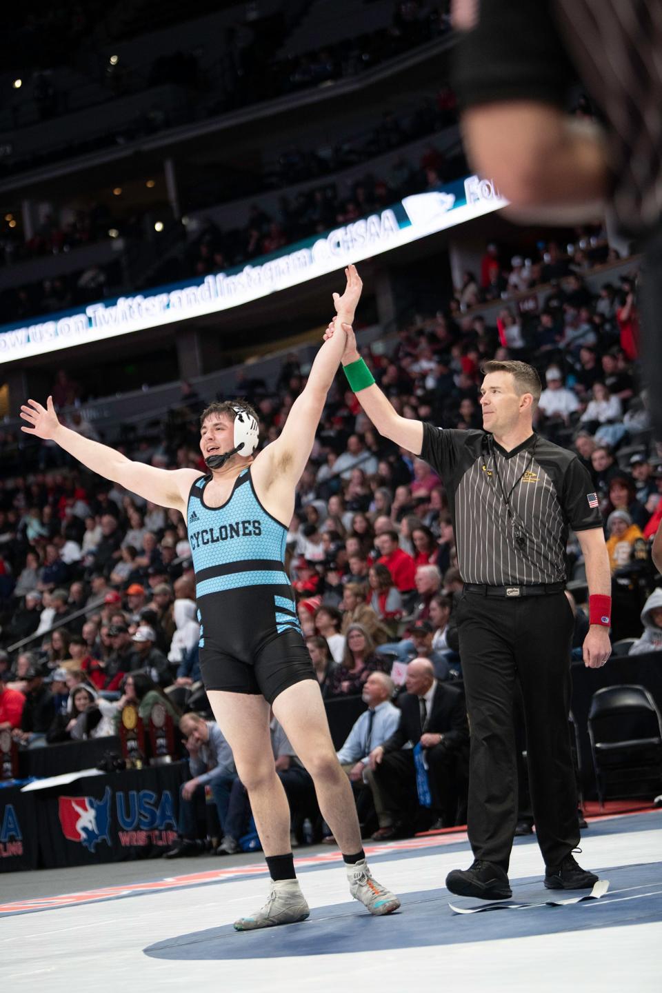 Pueblo West's Thomas Mayer has his hand raised as the winner of the 215-pound championship match of the Class 4A state wrestling tournament at Ball Arena on Saturday, Feb. 18, 2023.
