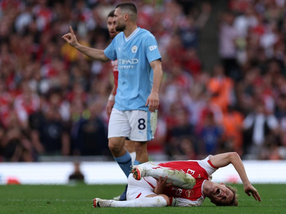 Mateo Kovacic was lucky to avoid a red card after challenges on Martin Odegaard and Declan Rice (AFP/Getty)