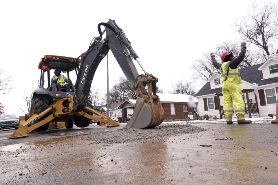 Memphis Light Gas & Water makes repairs to a broken water main in north Memphis Monday, Jan. 22, 2024, in Memphis, Tenn. Memphis and the the surrounding area has endured a week of sub-freezing temperatures, snow and ice. (AP Photo/Karen Pulfer Focht)