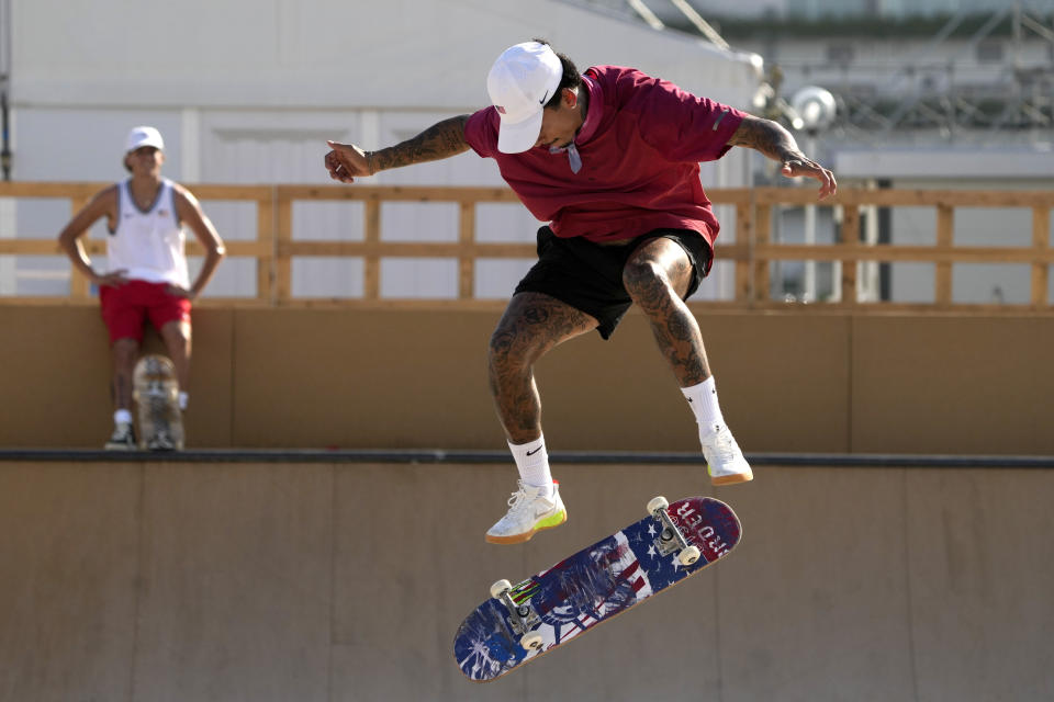 Nyjah Huston, from the United States, practices for the skateboarding competition in the 2020 Summer Olympics, Tuesday, July 20, 2021, at the Ariake Urban Sports Park in Tokyo. (AP Photo/Charlie Riedel)