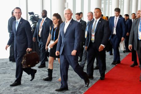 U.S. Vice President Mike Pence reacts as he walks past China's President Xi Jinping (not pictured) while leaving APEC Haus, during the APEC Summit in Port Moresby, Papua New Guinea November 18, 2018. REUTERS/David Gray