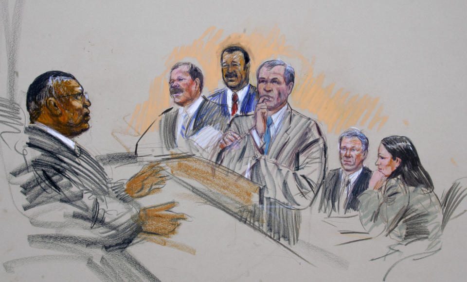FILE - In this artists rendering, U.S. District Judge Reggie Walton talks with prosecutor Patrick Fitzgerald, center, with defense attorney's William Jeffress and Theodore V. Wells, as I. Lewis 'Scooter' Libby and defense team member K.C. Maxwell listen in Federal Court in Washington, March 5, 2007. (AP Photo/Dana Verkouteren, File)