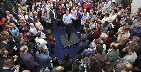 Britain's Prime Minister David Cameron answers questions from O2 employees during an election campaign stop in Leeds, England, April 16, 2015. REUTERS/Peter Macdiarmid/Pool