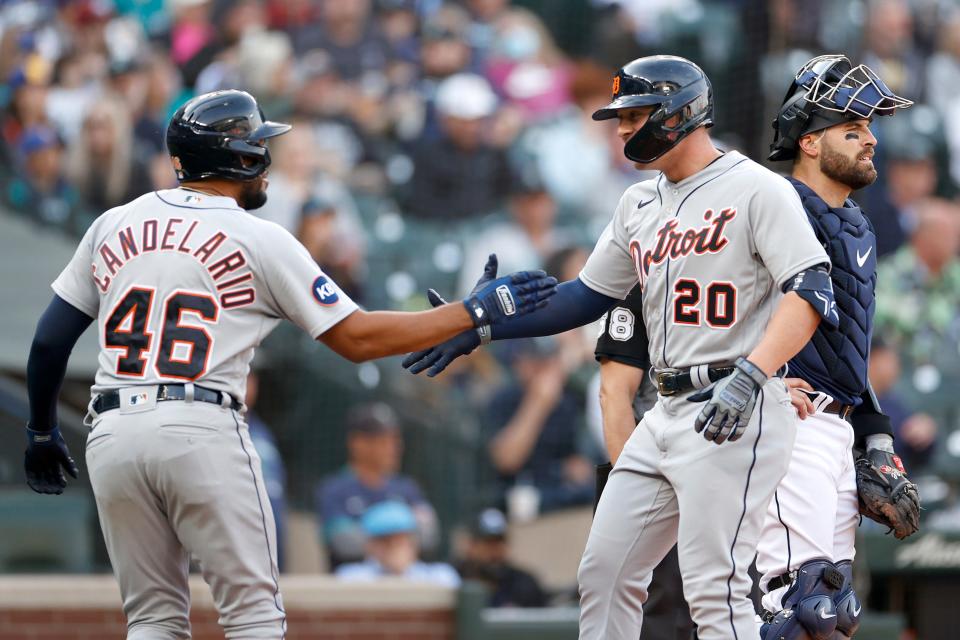 Tigers first baseman Spencer Torkelson, right, celebrates his two-run home run with third baseman Jeimer Candelario against the Mariners during the fourth inning of the first game of the doubleheader on Tuesday, Oct. 4, 2022, in Seattle.