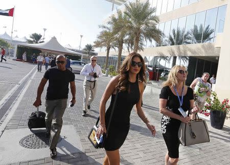 Singer Nicole Scherzinger (front C), arrives at the Abu Dhabi F1 Grand Prix at the Yas Marina circuit in Abu Dhabi November 23, 2014. REUTERS/Hamad I Mohammed