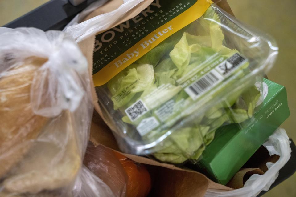 A mix of fresh and canned food items are placed in grocery bags at Bread for the City, Wednesday, May 10, 2023, at the food pantry in Washington. The formal end of the national Public Health Emergency on Thursday marks the end of several U.S. pandemic-era emergency support program, from extra food assistance to automatic enrollment in Medicaid. (AP Photo/Jacquelyn Martin)