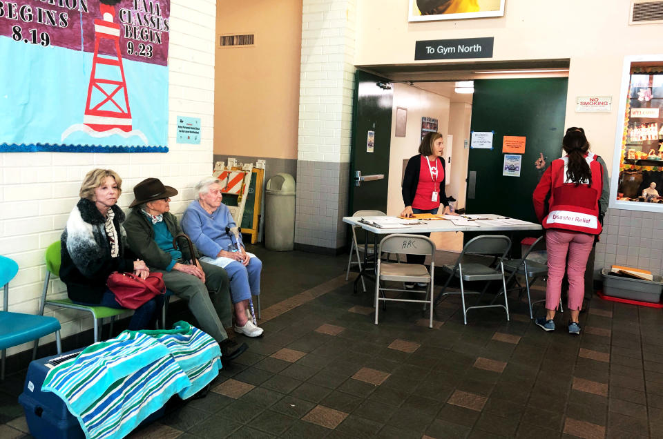 Evacuees fleeing the Getty wildfire take refuge at the Westwood Recreation Center in the western section of Los Angeles Monday, Oct. 28, 2019. (AP Photo/Stefanie Dazio)