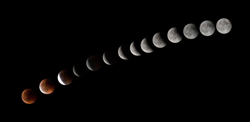 <p>This combination of 14 pictures put together in Photoshop and taken on July 27, 2018, shows the moon during a total lunar eclipse near La Puente, on the island of Tenerife. (Photo: Desiree Martin/AFP/Getty Images) </p>