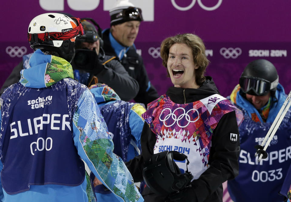 Switzerland's Iouri Podladtchikov celebrates after his half pipe run during the men's snowboard halfpipe final at the Rosa Khutor Extreme Park, at the 2014 Winter Olympics, Tuesday, Feb. 11, 2014, in Krasnaya Polyana, Russia. Podladtchikov won the gold medal. (AP Photo/Andy Wong)