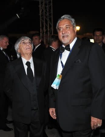 Bernie Ecclestone (L), chief executive officer and president of the Formula One's governing body, is seen with Force India Formula One racing team Principal Vijay Mallya during the 2011 REUTERS/Prakash Singh/Pool