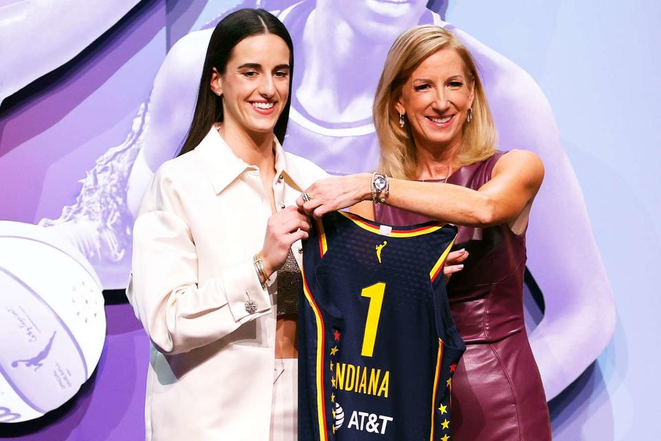 <p>Sarah Stier/Getty</p> From Left: Caitlin Clark with WNBA Commissioner Cathy Engelbert 