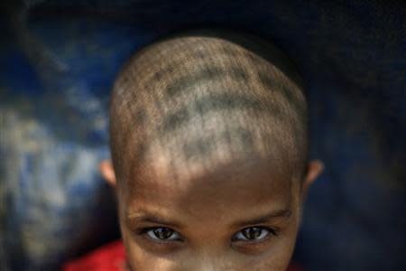 A displaced Rohingya girl is pictured at the Kyein Ni Pyin camp for internally displaced people in Pauk Taw, Rakhine state, April 23, 2014. REUTERS/Minzayar