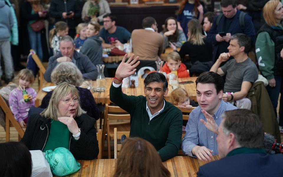 Rishi Sunak meets members of the public during a visit to the Altrincham Food Market in Greater Manchester