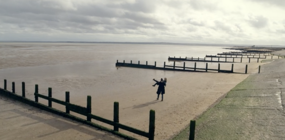 Jack sweeps Nikki off her feet on a beach in Silent Witness