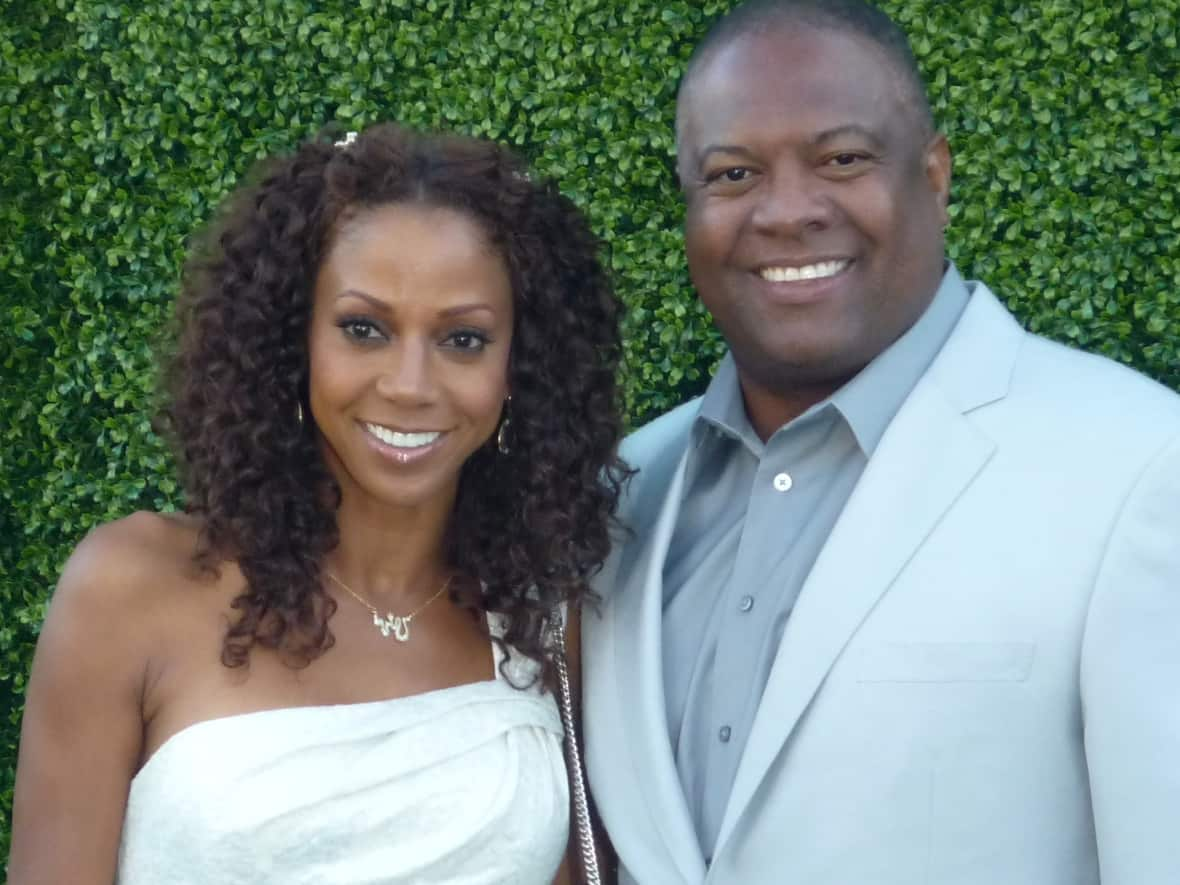 Actor Holly Robinson Peete and her husband, former NFL quarterback Rodney Peete, pictured in 2010. Two of their sons were barred from boarding a flight at Vancouver International Airport on Monday. (Greg Hernandez/Creative Commons - image credit)