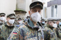 Soldiers of the Bundeswehr stand in the inner courtyard of the town hall in Duesseldorf, Germany, Tuesday, Nov. 30, 2021. In view of the sharp rise in the number of Corona infections, local authorities in North Rhine-Westphalia are again increasingly asking the Bundeswehr for help. (Rolf Vennenbernd/dpa via AP)