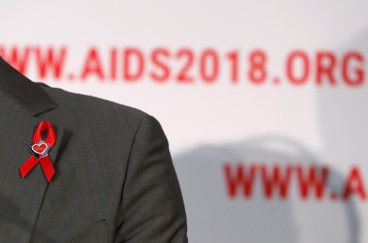 A red ribbon is seen on the jacket’s lapel of Elizabeth Taylor AIDS foundation ambassador Quinn Tivey as he attends the opening news conference at the 22nd International AIDS Conference (AIDS 2018), the largest HIV/AIDS-focused meeting in the world, in Amsterdam, Netherlands, on 23 July, 2018. (PHOTO: Reuters)