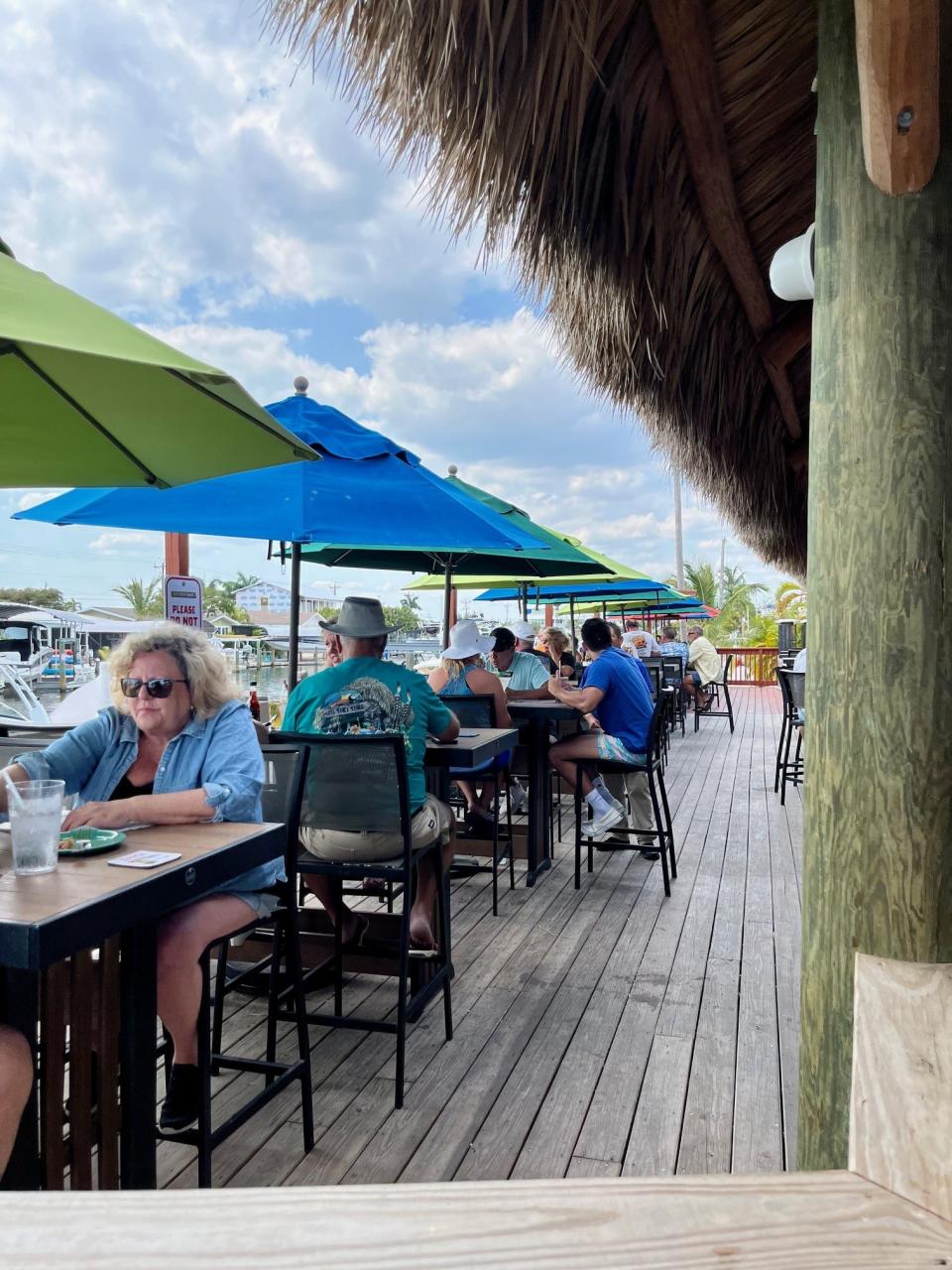 The waterfront seats on the outside rail fill up fast at Phuzzy's Boat Shack on Pine Island.