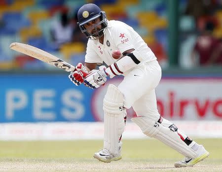 India's Amit Mishra plays a shot during the fourth day of their third and final test cricket match against Sri Lanka in Colombo August 31, 2015. REUTERS/Dinuka Liyanawatte