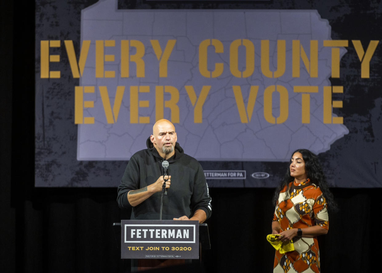 Democratic Senate candidate Lt. Gov. John Fetterman (D-PA) speaks during a rally as his wife Gisele Barreto Fetterman looks on at the Bayfront Convention Center on August 12, 2022 in Erie, Pennsylvania. (Nate Smallwood/Getty Images)