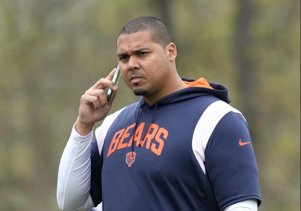 Chicago Bears general manager Ryan Poles talks on the phone as he watches players during the NFL football team’s rookie minicamp at Halas Hall in Lake Forest, Ill., Saturday, May 6, 2023. (AP Photo/Nam Y. Huh) ORG XMIT: ILNH123