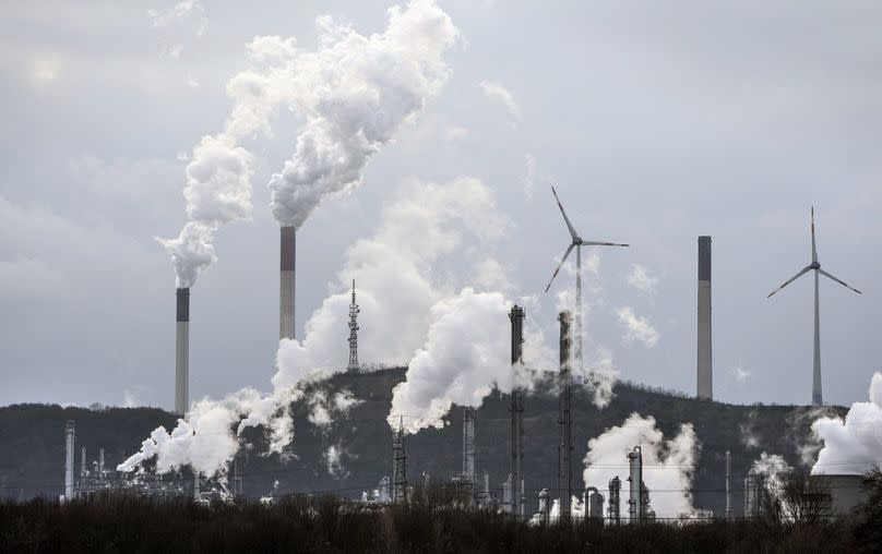 The industrial backdrop of a refinery and a coal-fired power plant are seen in Gelsenkirchen, March 2023