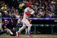 Apr 20, 2019; Denver, CO, USA; Philadelphia Phillies right fielder Bryce Harper (3) watches his ball on a three run home run in the seventh inning against the Colorado Rockies at Coors Field. Mandatory Credit: Isaiah J. Downing-USA TODAY Sports