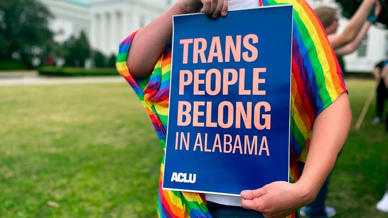 PHOTO: A person holds up a sign reading, 'Trans People Belong in Alabama,' during a rally outside the Alabama Statehouse in Montgomery, Ala., on International Transgender Day of Visibility, March 31, 2023.  (Kim Chandler/AP, FILE)